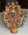 Vintage Mexican ceramic 'Tree of Life' candelabra with large footed ring base. Figured depicted include Adam and Eve, the...