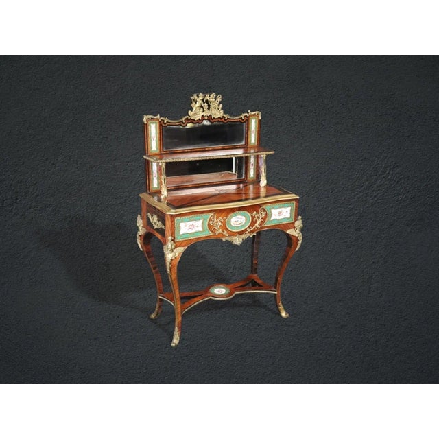 An exquisite example of 19th-century French luxury, this Louis XV style vanity combines masterful cabinetmaking with fine...