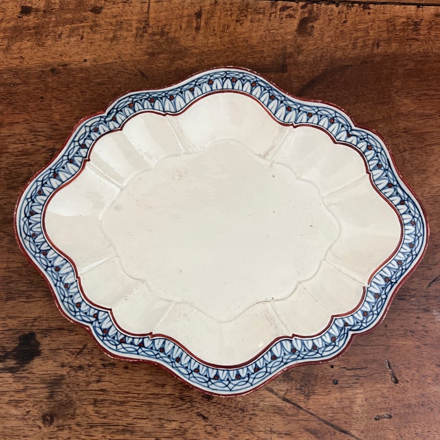 antique English creamware or pearlware oval platter, likely dating from the late 18th to the early 19th century (circa...