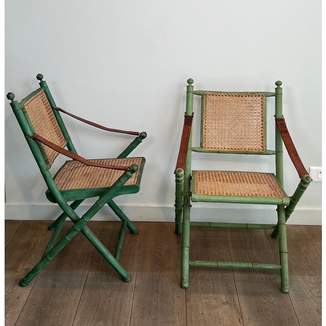 Pair of 1970s folding safari chairs in weathered faux bamboo with caned backs and seats For Sale - Image 4 of 12