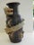 A large dynamic gorgeous ceramic Thai dragon vase. A black ground patina with a figurative dragon-detailed with scales,...