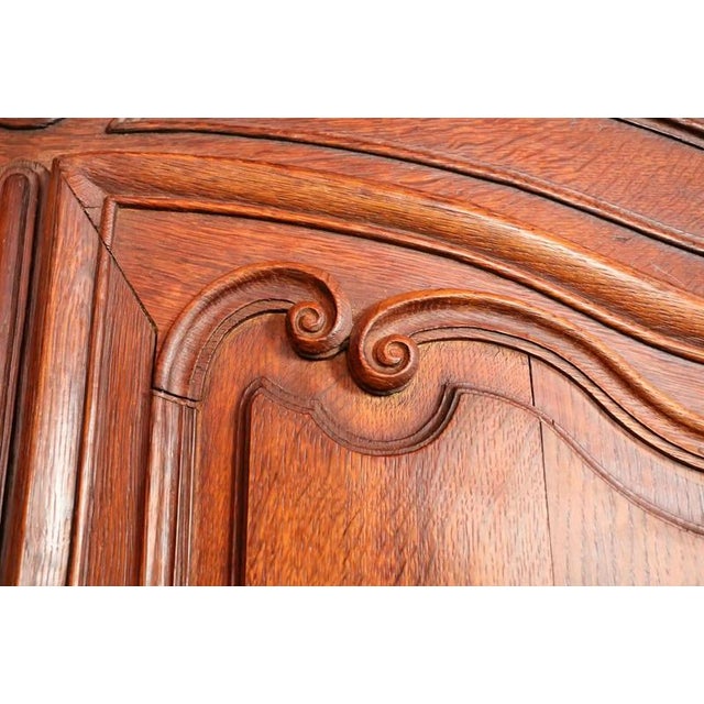 Massive oak wardrobe from the period of Louis XIV (the Sun King). Two-door wardrobe connected by a groove + tenon + peg. A...