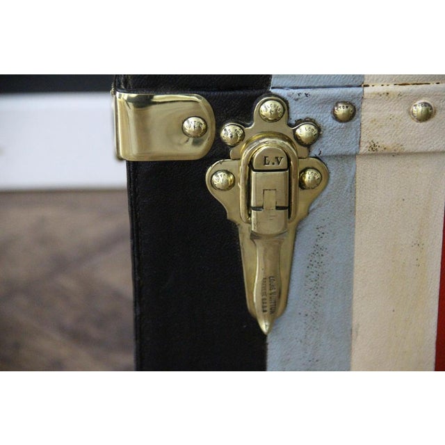 A magnificent Louis Vuitton car trunk made of waterproof black canvas, in excellent original condition, featuring solid...