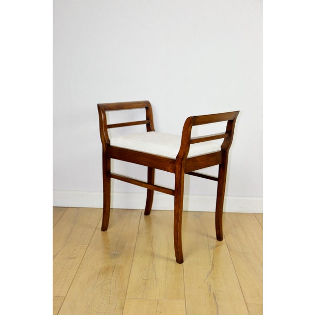 Stool seat made of white-cream velvet fabric and oak in Art Deco style. Art Deco-style stool with handles, originally...