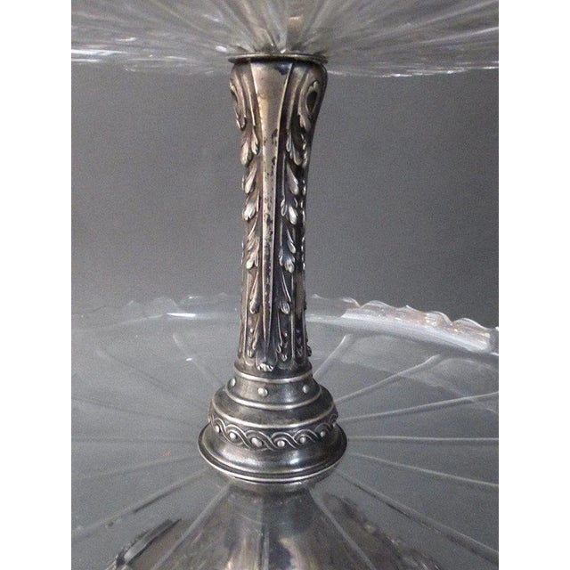 Dumb silver servant with two crystal trays. The shower foot is decorated with four medallions of women in the antique...