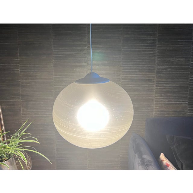 This Space Age pendant lamp by Peill Putzler is more of a work of art than an ordinary pendant lamp. with its diameter of...
