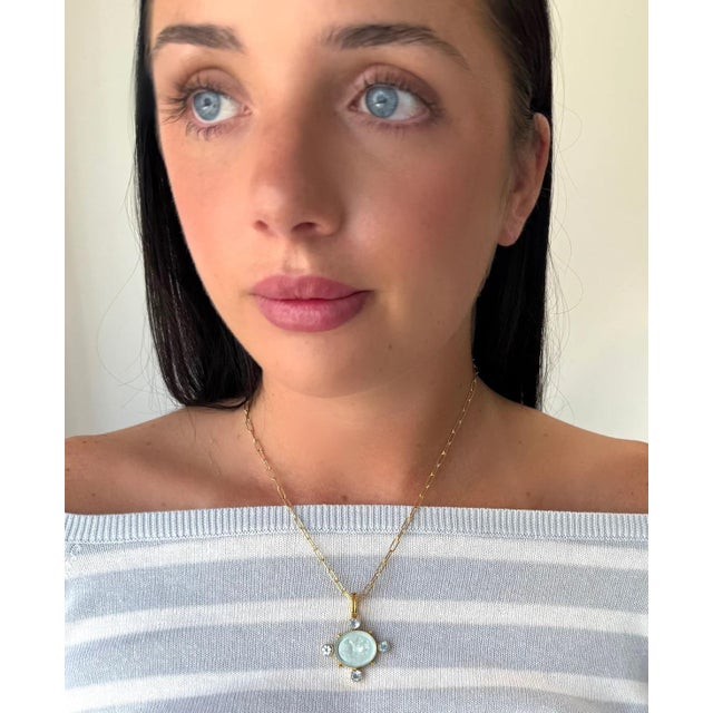 This two piece set includes a petite gold filled chain with an Intaglio enhancer featuring Cupid riding a dolphin and is...