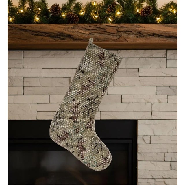 This one-of-a-kind Christmas stocking is hand-cut from a genuine vintage wool kilim in a soft sage green and olive...
