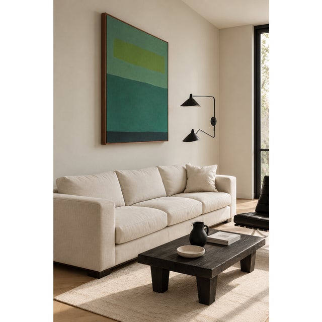 This contemporary abstract painting explores the serene richness of green through a restrained composition of layered...