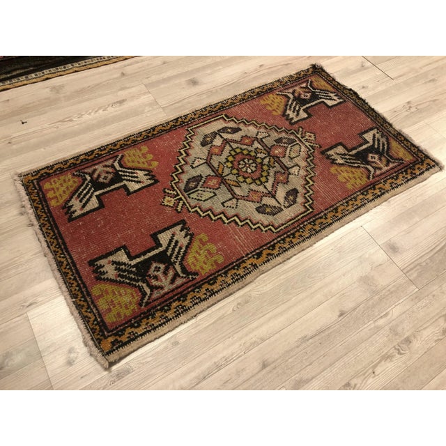 This is a vintage Turkish Oushak rug from the 1960s. The piece was hand-knotted.