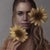 Joie by Kelly Birkenruth | Oil on Panel Portrait of a woman holding sunflowers. For Sale
