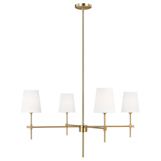 The Baker four light single tier chandelier in satin brass supplies ample lighting for your daily needs, while adding a...
