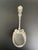 Antique sterling preserve spoon in the Louis XV pattern by Whiting Manufacturing Co. The design features the handle and...