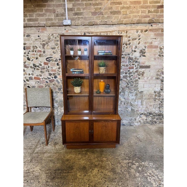 Rare example of an original mid century teak bookcase by Turnridge of London. Label on base door (see photos). The cabinet...