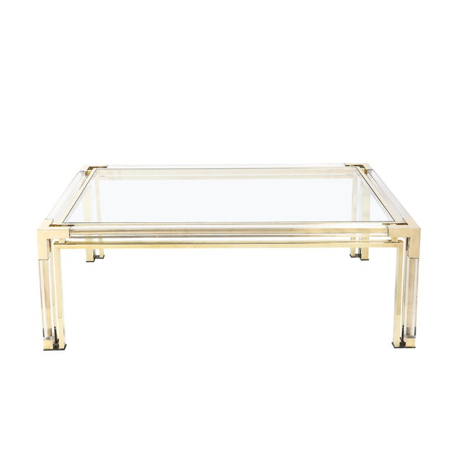 This exquisite Mid-Century Modernist cocktail table by the renowned French design firm Maison Jansen, Circa 1970, is a...