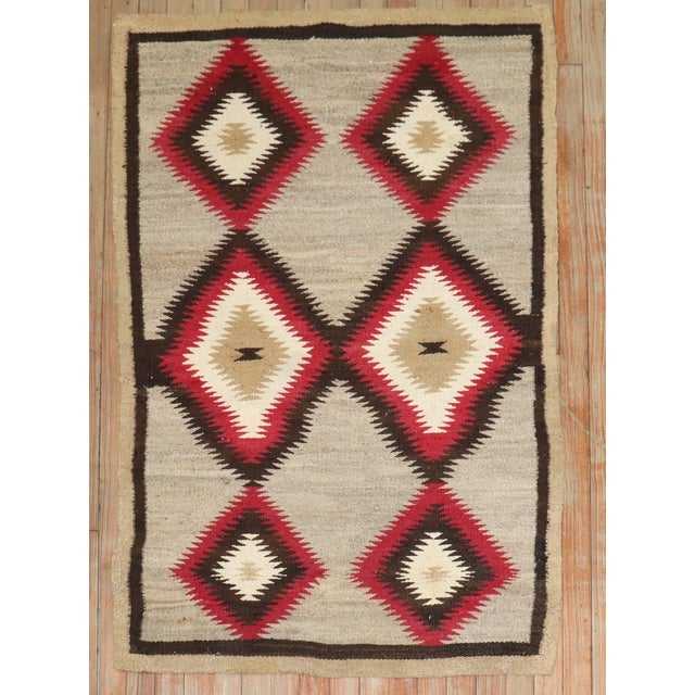 An early 20th Century American Navajo tribal blanket weaving. T Details rug no. j3922 size 2'11'' x 4' 6"