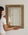 This 19th century oak mirror from France is framed in pale, textured oak, a mirror with a broad, softly worn border. The...
