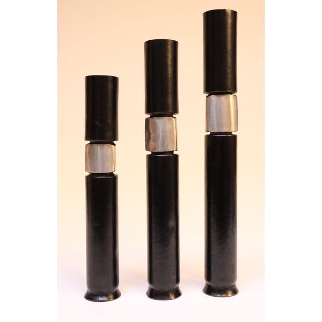 Trio of Brutalist-style graduated candleholders by famed metalsmith, Thomas Roy Markusen, who was previously commissioned...