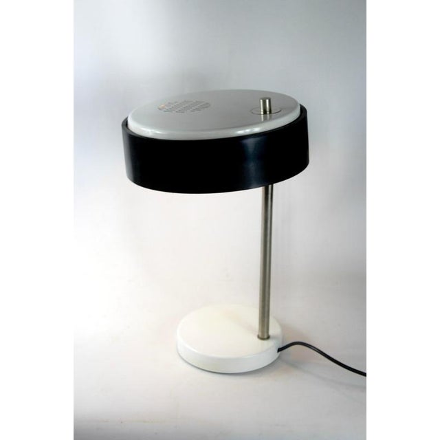 Vintage 1950’s table lamp or desk lamp made in Germany. White shade and base with a black ring. This model is slightly...