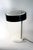 Vintage 1950’s table lamp or desk lamp made in Germany. White shade and base with a black ring. This model is slightly...