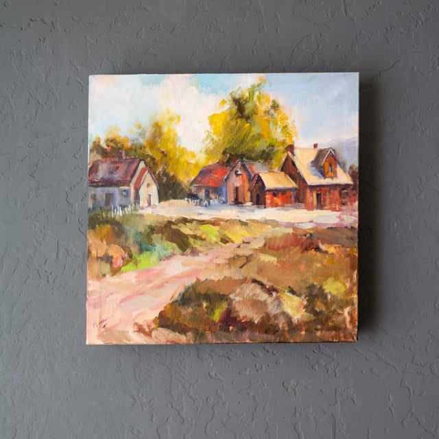 A vibrant rural autumnal landscape painting in an impressionist style features lively colors of peach, sky blue, red, and...