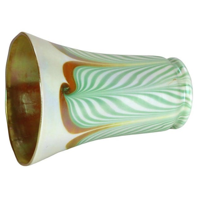An exquisite Steuben art glass shade, exemplifying the distinctive pulled feather technique popular during the Arts &...