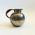 A mid century pewter pitcher. Nice round shape with a wicker wrapped handle for heat protection. Good size for serving or...