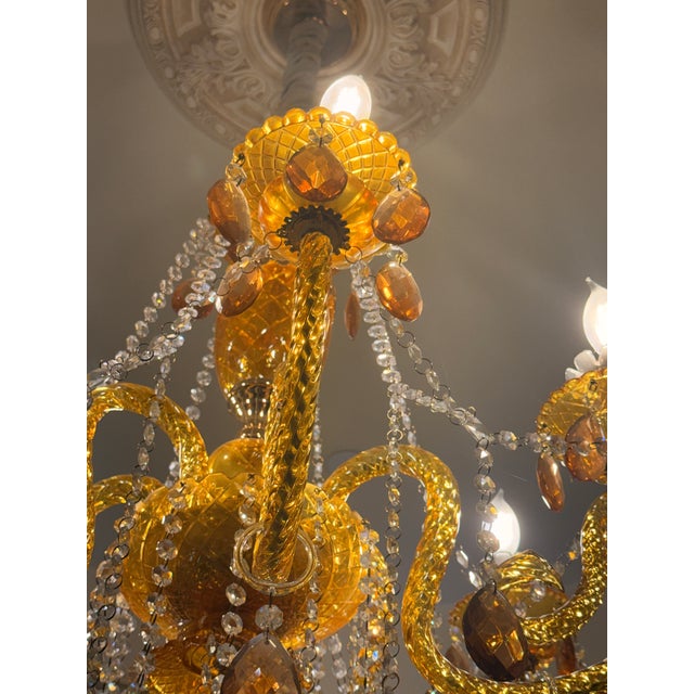 European Imported Gilded Amber Glass Chandelier A stunning 6-arm European-imported chandelier crafted entirely from glass,...
