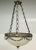 Antique bronze chandelier with a nickel finish and a cut glass shade. The canopy is labeled Bronze Veritable....