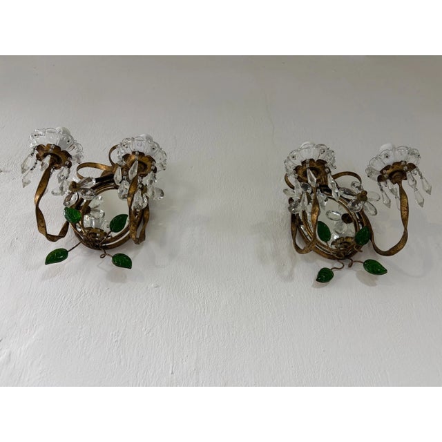 Housing 2 lights each, sitting in crystal bobeches with crystal beads. These will arrive rewired with certified US UL...