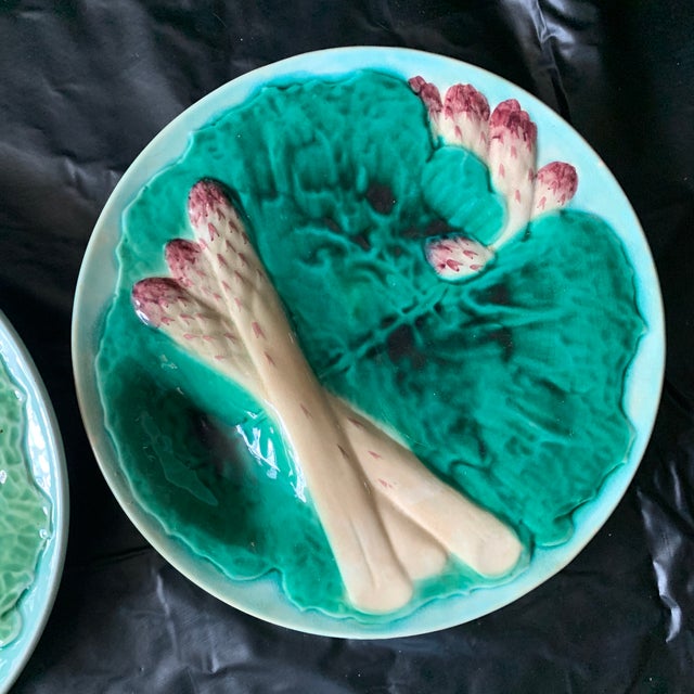 The pictured antique dishes are 19th-century French majolica asparagus plates produced by the renowned Creil et Montereau...