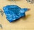 Vintage Chinese carving figurine of a blue sodalite stone duck figurine on a wood carved stand.