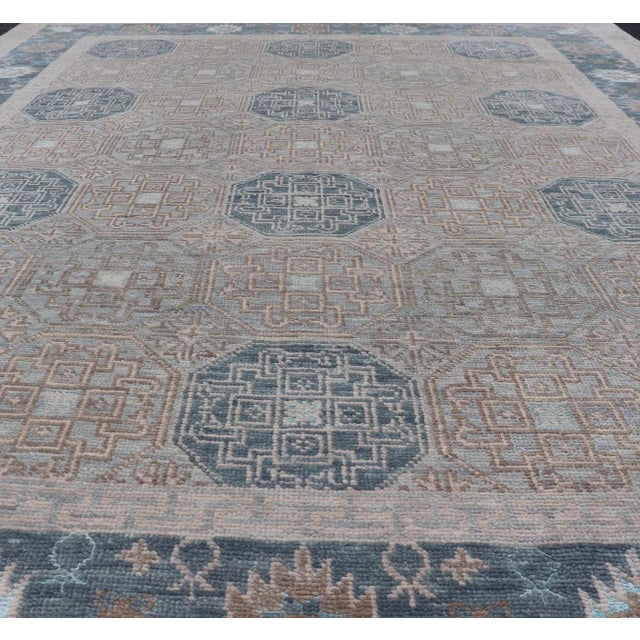 Modern Hand Knotted Khotan in Wool With All-Over Medallion Design in Blue and Earthy Tones For Sale - Image 9 of 13