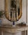An elegant early 20th century Gustavian-style girandole combining aged brass, cobalt blue glass, clear faceted crystal,...