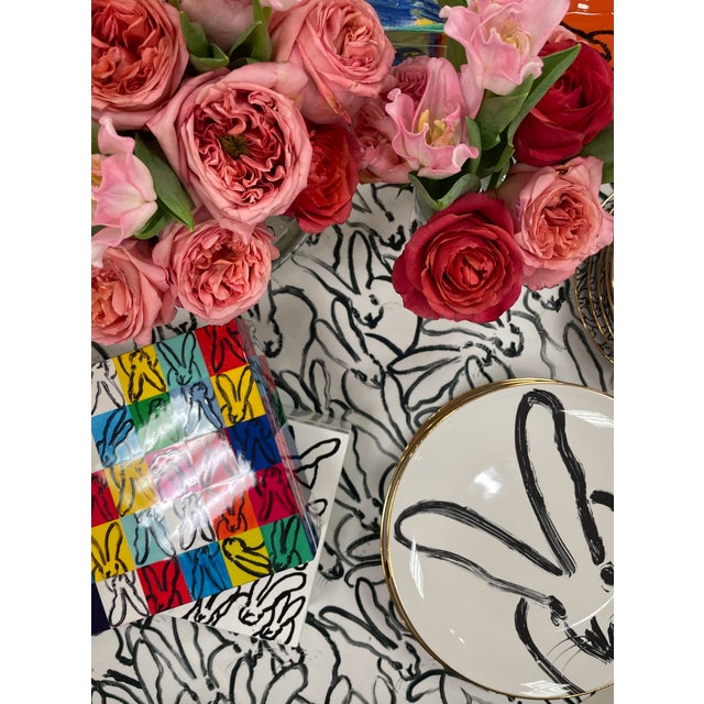 Artfully designed ceramic plate featuring one of Hunt Slonem's favorite bunnies on the front and a fluffle of bunnies...