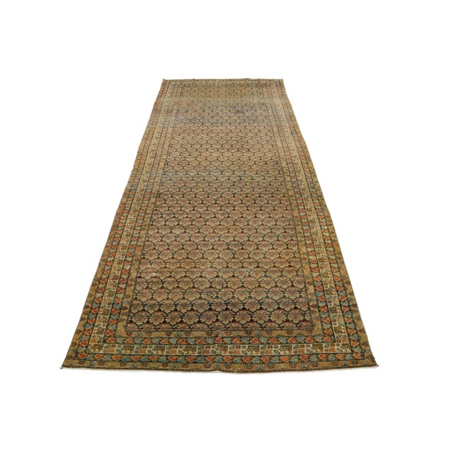 This exceptional antique Persian Malayer rug is made of handcrafted wool. The rug's design showcases a combination of blue...