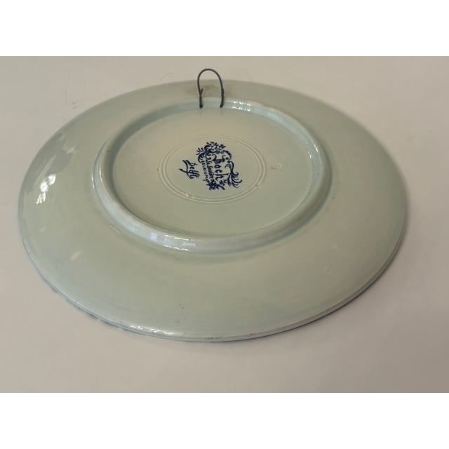 Freres-Keramis creators of this unique WANDBORDEN meaning Old lady reading a book. This is a blue and white plate made in...