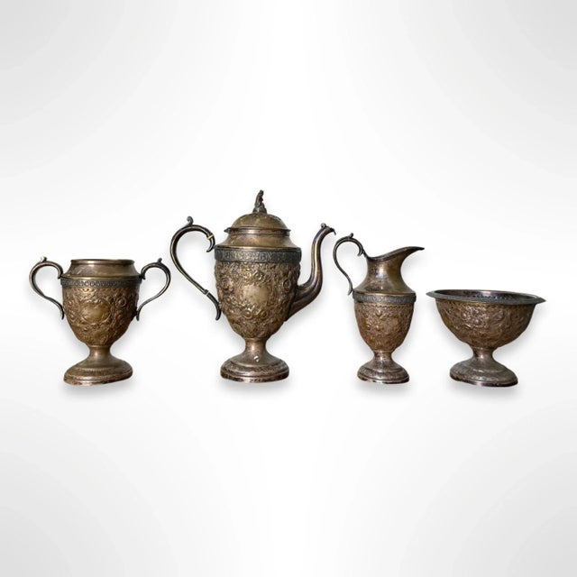 A high quality antique Chinese silvered copper tea set that dates back to the early 1800s. The four-piece set includes a...