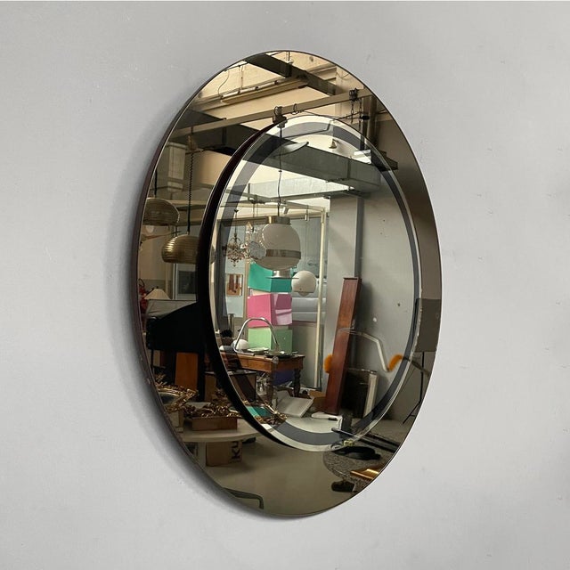 Italian modern round double-glass wall mirror, 1970s Round wall mirror featuring a mirrored surface and a smoked mirrored...