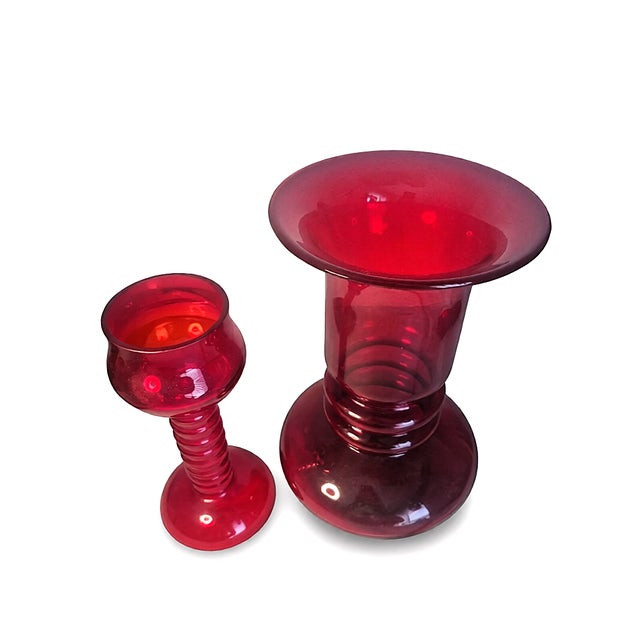 A striking matched pair of hand-blown Czech art glass in a rich gold ruby / cranberry red color. The set includes one...