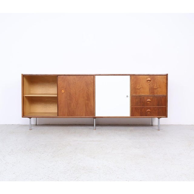 Stylish mid-century modern sideboard designed by william watting for fristho franeker in the 1960s. this sideboard is a...