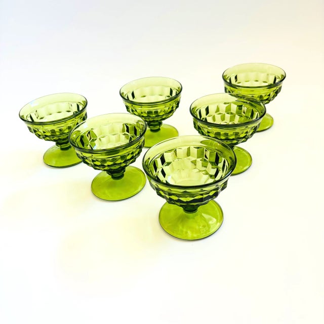 A set of 6 vintage coupe glasses with a cubist design in green glass. Made in the Whitehall pattern by Indiana Glass....