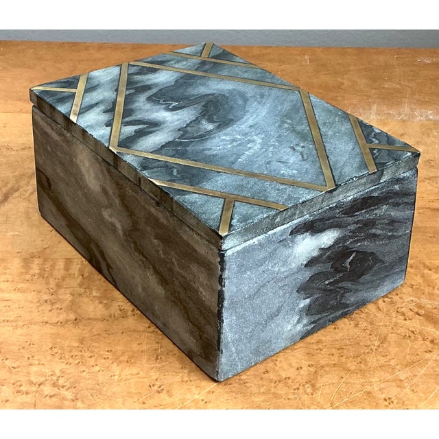 This vintage stone box is a sophisticated example of mid-century decorative design, combining the natural beauty of richly...