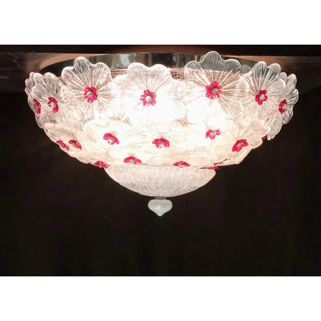 Ceiling with Murano glass flowers worked on the plate and hand transparent color with colorful flower -shaped fixing...