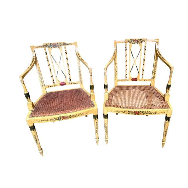 These Antique Neoclassical armchair chairs feature a cream painted wood finish with floral hand-painting and removable...