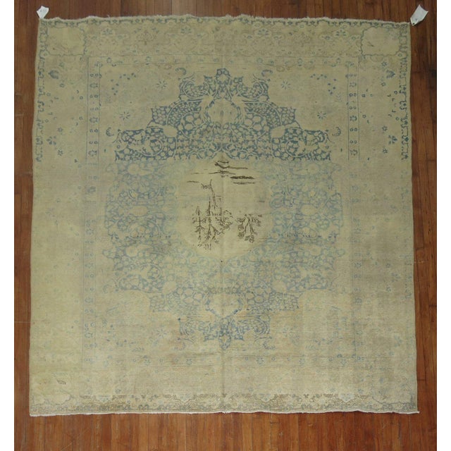 A 20th-century room size Persian Kerman rug in beige, light blue, green brown, and beige Measures: 8'3'' x 9'10''