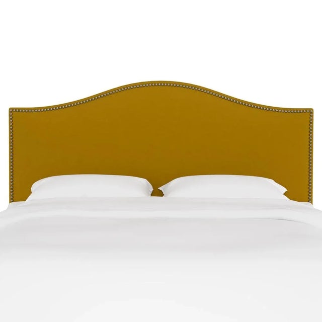 Give your interior a lift with the Headboard. Featuring the delicate curves of a classic camelback design, with subtle...