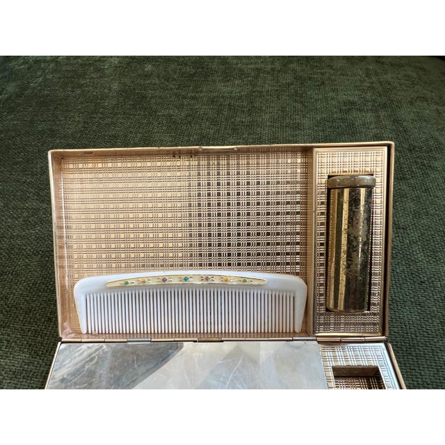 1950s Mid-Century Evans Wristlet Compact Vanity Kit and Cigarette Case This 1950s mid-century EVANS wristlet compact...