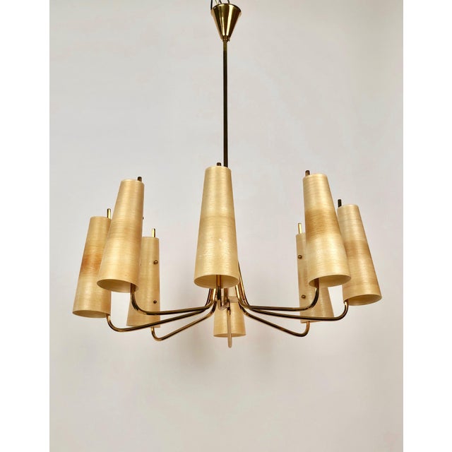 Mid-century chandelier with eight arms in brass. The arms are made from hexagonal tubbing giving the chandelier a unique...