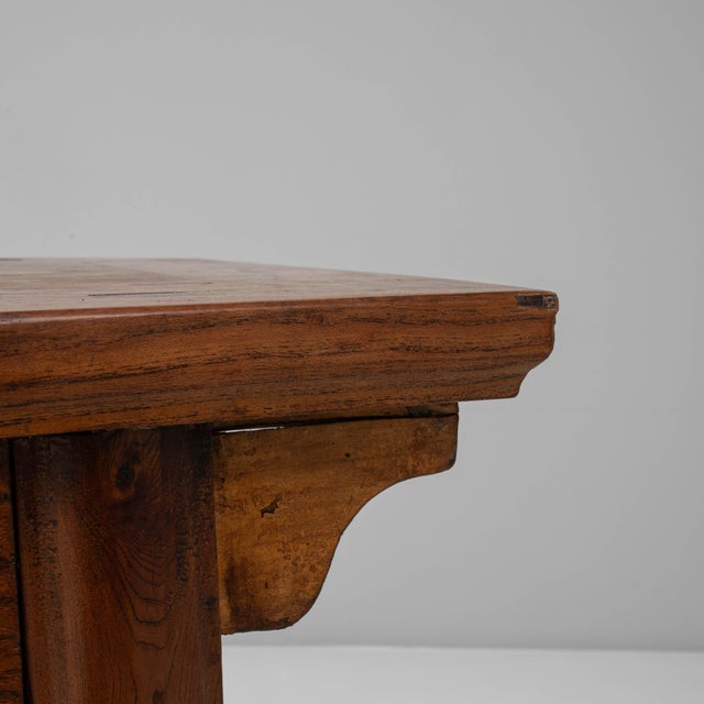 This 19th Century Chinese Provincial Wooden Console Table embodies the refined simplicity of rural craftsmanship....